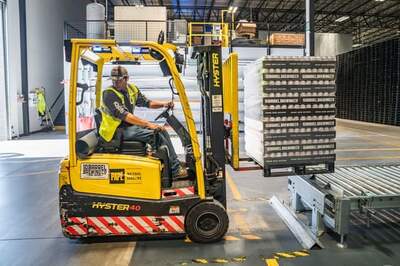 Photograph of a forklift with sensors transporting products