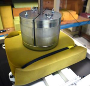 Indentor with weights, test sample and platen