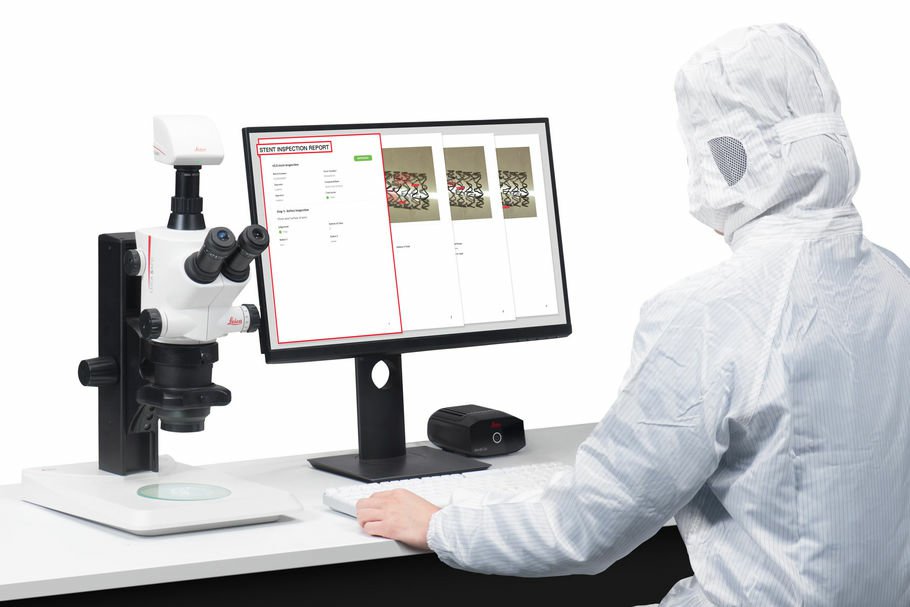Clean room technician operating a leica microscope