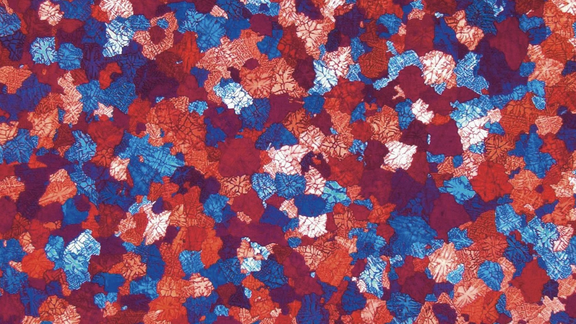 Coloured grains in a metal surface analysis
