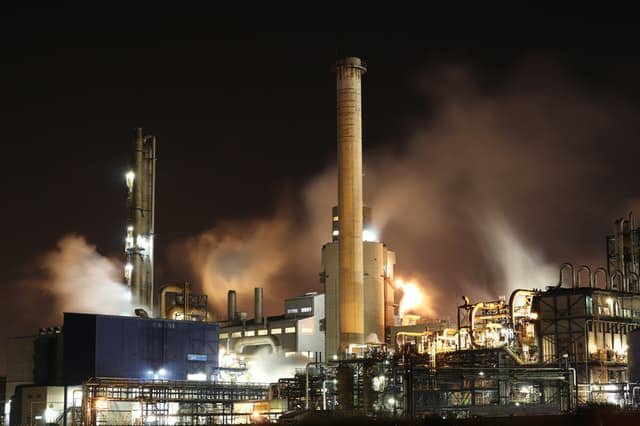 Photograph of an oil refinery at night