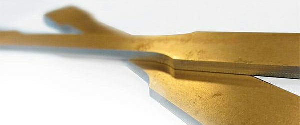 Two brass flat tensile samples machined efficiently by TensileMill equipment